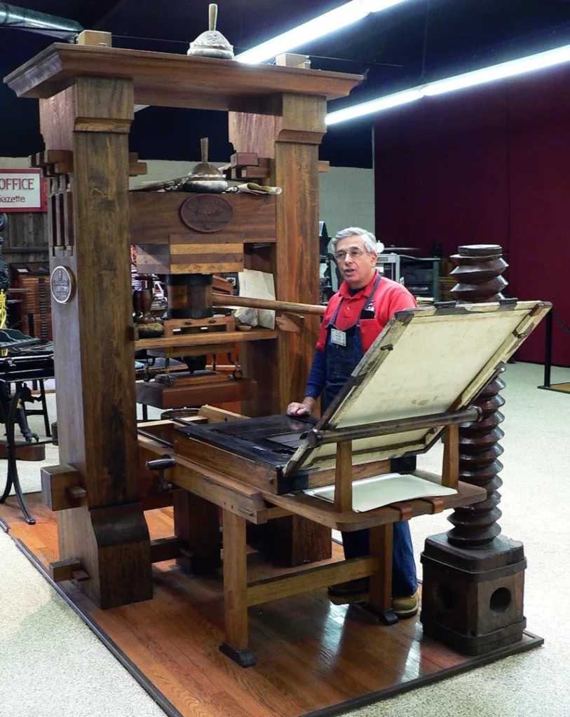 Replica of an early printing press demonstrating the historical origins of book production relevant to copyright law development. 